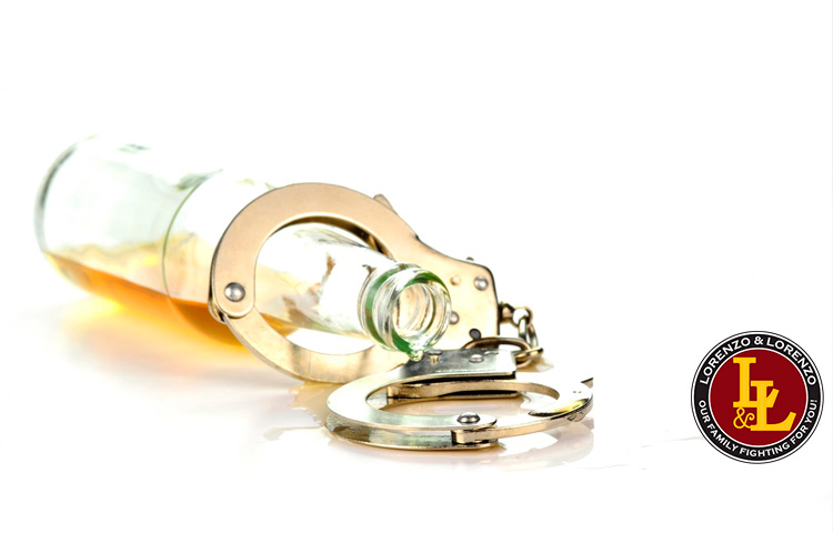 image of a bottle of alcohol and handcuffs