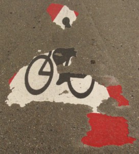 fading bicycle sign on street: Lorenzo Personal Injury Blog
